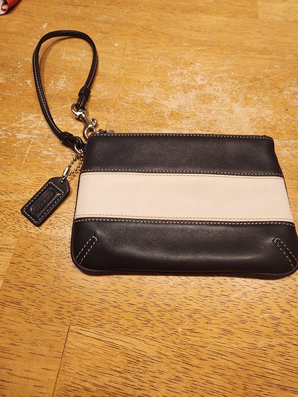 vintage Coach leather wristlet featuring a black and white colorblock